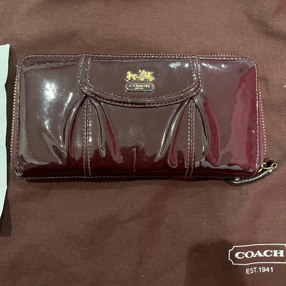 Plum colored patent leather coach wallet